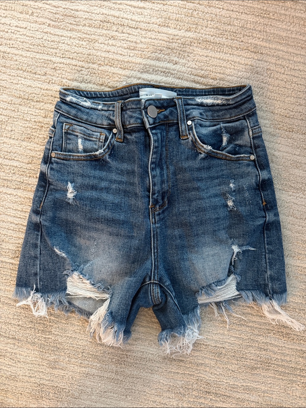 High-Rise Distressed Denim Shorts in Blue